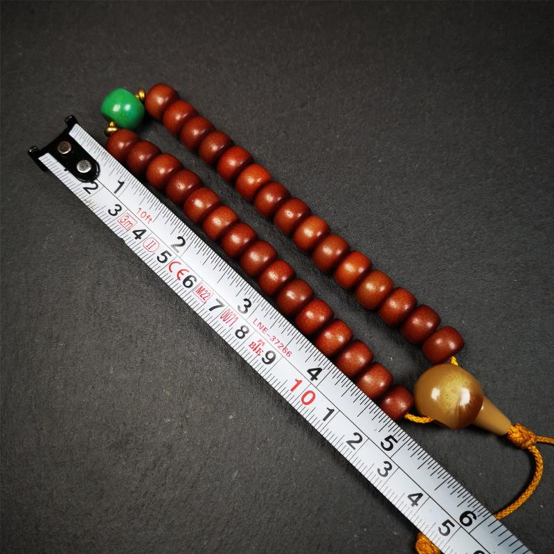 This bracelet mala was made by Tibetan craftsmen and come from Hepo Town, Baiyu County, the birthplace of the famous Tibetan handicrafts. It is made of Corypha Linn Seeds, diameter of 10mm / 0.4",circumference is 26cm / 10" ,with turquoise spacer bead, end of a yak horn guru bead.