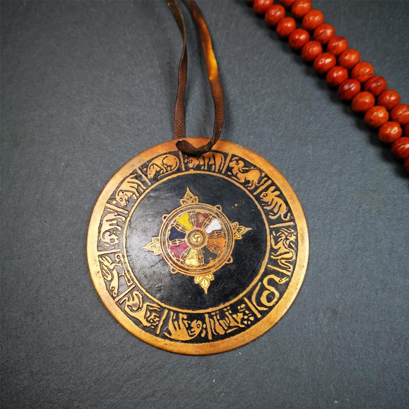 This beautiful prayer wheel badge was collected in Derge, Tibetan. It is made of brass, carved paryer wheel in the middle and Tibetan zodiac signs around it,then painted with color,size is 2.95". You can hang it at the door or in your shrine.