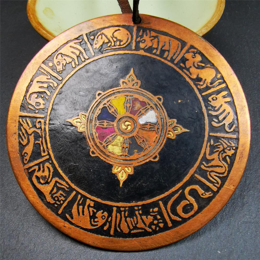 This beautiful prayer wheel badge was collected in Derge, Tibetan. It is made of brass, carved paryer wheel in the middle and Tibetan zodiac signs around it,then painted with color,size is 2.95". You can hang it at the door or in your shrine.