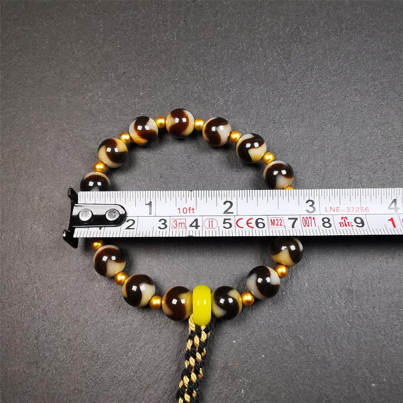 This tiger tooth dzi bracelet was hand-woven by Tibetans from Baiyu County,Tibet. It consists of 15 tiger tooth dzi beads and 15 spacer beads,tie with elastic cord to fit your wrist. Dzi beads are precious jewelry from Tibetan culture which are believed to possess the power of bringing good fortune to the owners. You'll get 1 dzi bracelet as pictures shown.