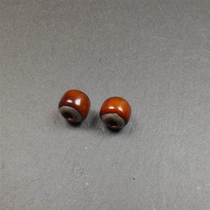 These marker beads were handmade by Tibetan craftsmen and come from Hepo Town, Baiyu County, the birthplace of the famous Tibetan handicrafts. It is made of yak bone,inlaid cold iron,brown color,size is 0.47" × 0.4". Fit for 8-12mm mala (The reference in the photo is 9mm mala)