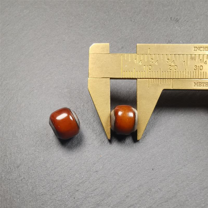 These marker beads were handmade by Tibetan craftsmen and come from Hepo Town, Baiyu County, the birthplace of the famous Tibetan handicrafts. It is made of yak bone,inlaid cold iron,brown color,size is 0.47" × 0.4". Fit for 8-12mm mala (The reference in the photo is 9mm mala)