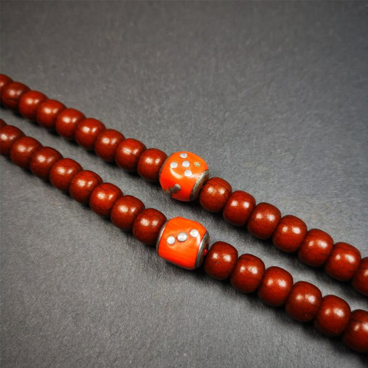 These marker beads were handmade by Tibetan craftsmen and come from Hepo Town, Baiyu County, the birthplace of the famous Tibetan handicrafts. It is made of plastic,inlaid cold iron,orange color,size is 0.47" × 0.47". Fit for 8-12mm mala (The reference in the photo is 8mm mala)