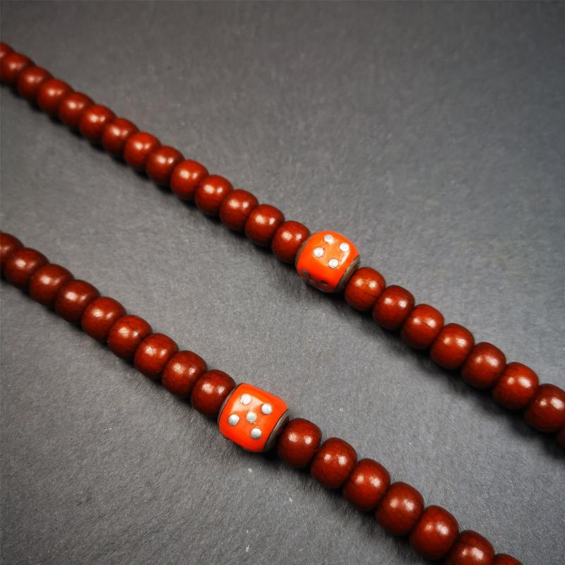 These marker beads were handmade by Tibetan craftsmen and come from Hepo Town, Baiyu County, the birthplace of the famous Tibetan handicrafts. It is made of plastic,inlaid cold iron,orange color,size is 0.47" × 0.47". Fit for 8-12mm mala (The reference in the photo is 8mm mala)