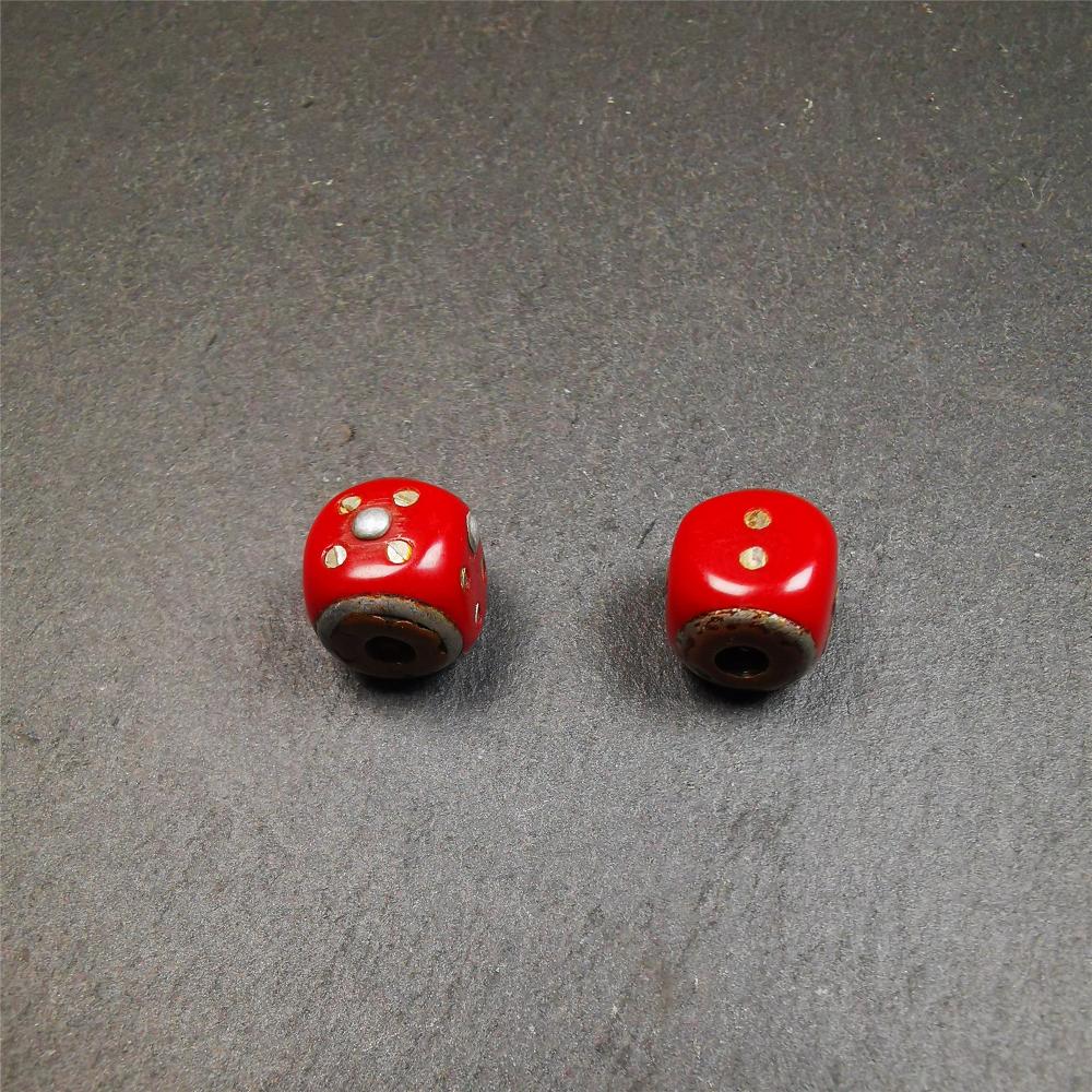 These marker beads were handmade by Tibetan craftsmen and come from Hepo Town, Baiyu County, the birthplace of the famous Tibetan handicrafts. It is made of plastic,inlaid cold iron,red color,size is 0.47" × 0.47". Fit for 8-12mm mala (The reference in the photo is 8mm mala)
