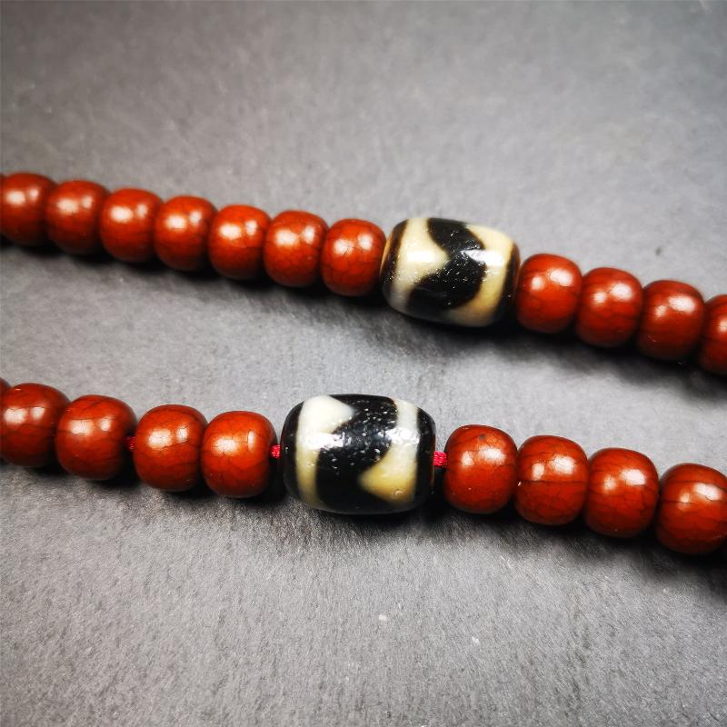 The list is a pair of tiger tooth dzi beads. These dzi beads were made in Tibet,can be used as marker beads for mala, or decorative beads on necklace or bracelet.
