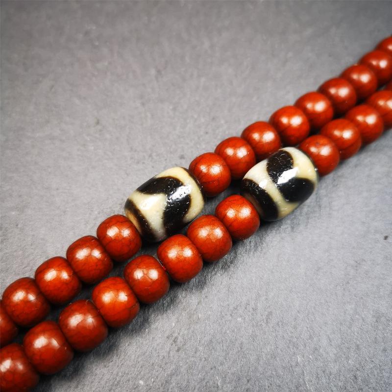 The list is a pair of tiger tooth dzi beads. These dzi beads were made in Tibet,can be used as marker beads for mala, or decorative beads on necklace or bracelet.