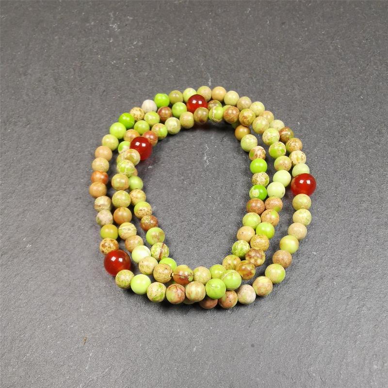 This small size turquoise mala was handmade from tibetan crafts man in Baiyu County. It's composed of 108 pcs 4mm turquoise beads, add 4 agate beads,string then with elastic cord and fit snugly around your wrist.