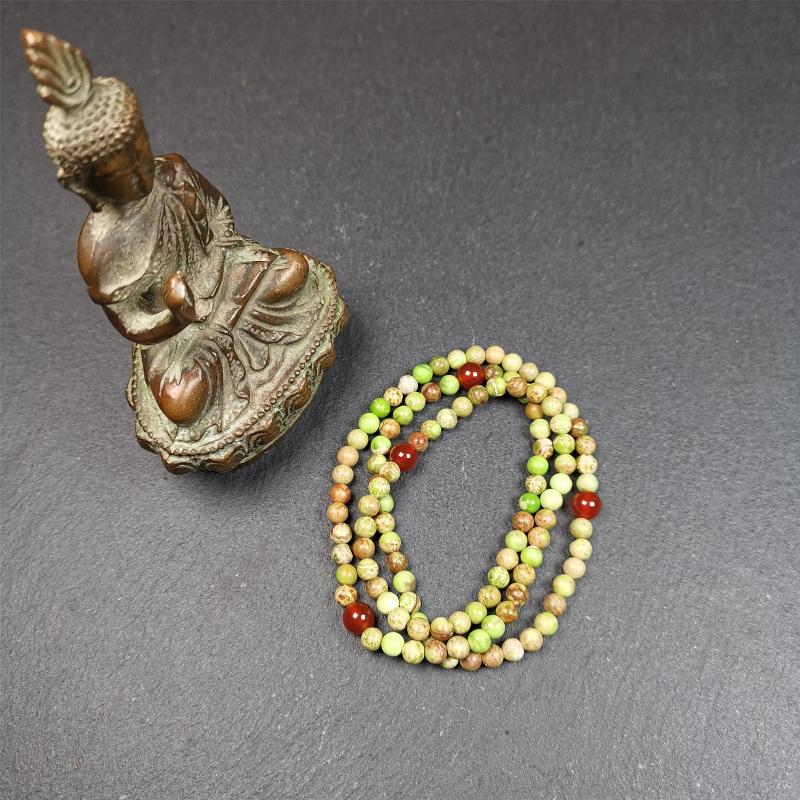 This small size turquoise mala was handmade from tibetan crafts man in Baiyu County. It's composed of 108 pcs 4mm turquoise beads, add 4 agate beads,string then with elastic cord and fit snugly around your wrist.