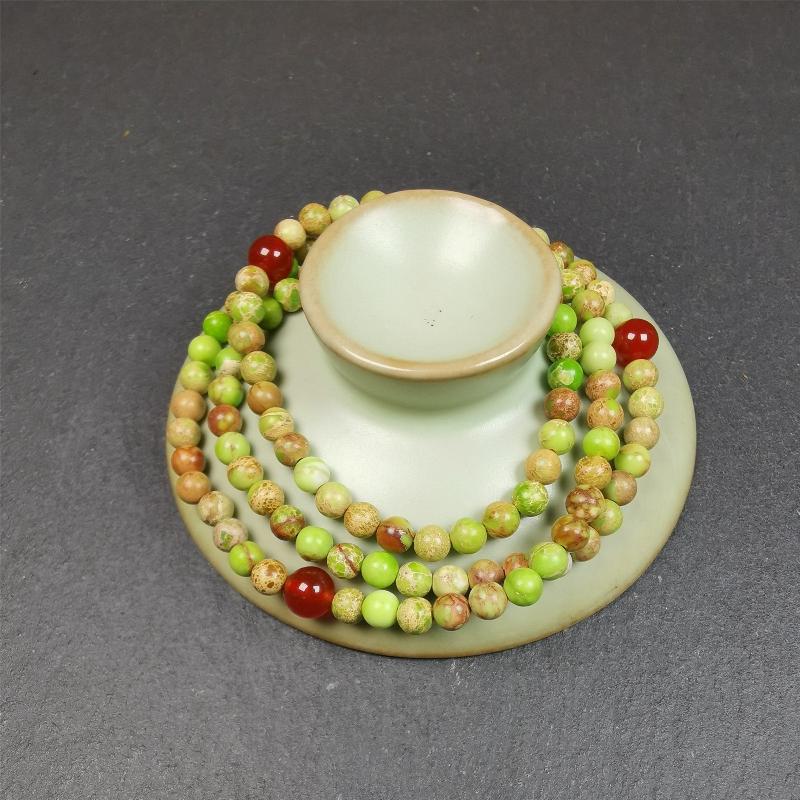 This small size turquoise mala was handmade from tibetan crafts man in Baiyu County. It's composed of 108 pcs 4mm turquoise beads, add 4 agate beads,string then with elastic cord and fit snugly around your wrist.