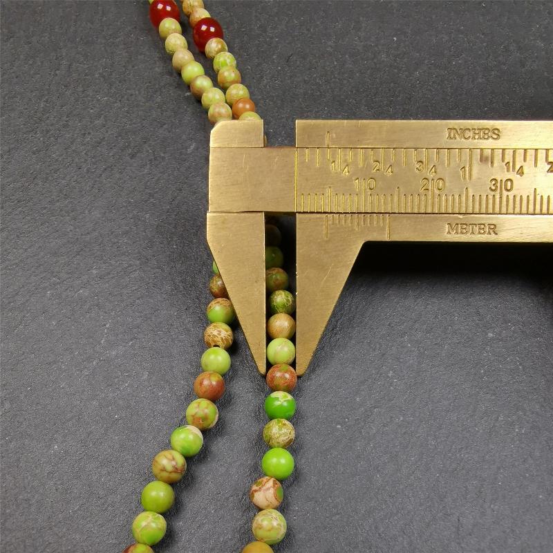 This small size turquoise mala was handmade from tibetan crafts man in Baiyu County. It's composed of 108 pcs 4mm turquoise beads, add 4 agate beads,string then with elastic cord and fit snugly around your wrist.