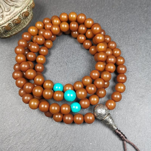 This mala was made by Tibetan craftsme.  It is made of Corypha Linn Seeds, diameter of 8.5mm,0.34 inch,circumference is 90cm,35 inches ,with 3 turquoise bead, end of a white copper guru bead.