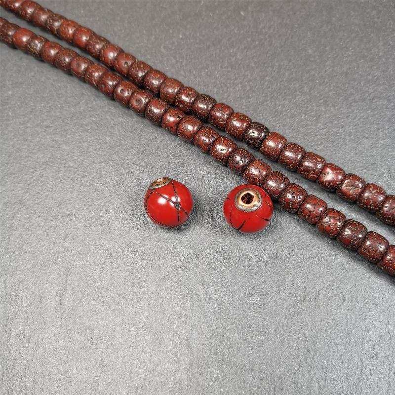 These marker beads were handmade by Tibetan craftsmen. It is made of plastic,inlaid copper and cold iron,red color,size is 0.6" × 0.6". Fit for 8-15mm mala (The reference in the photo is 8mm mala)