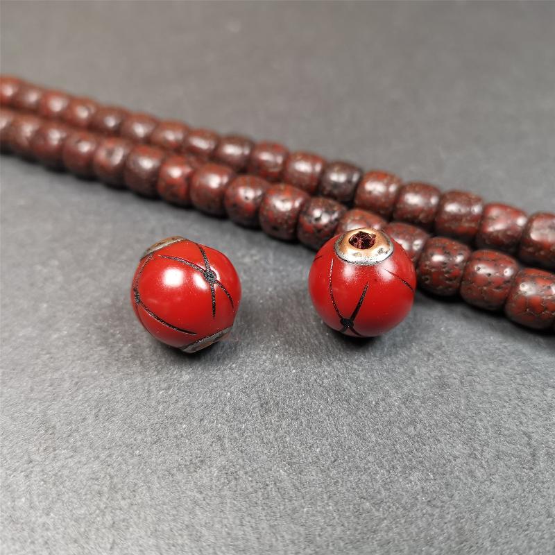 These marker beads were handmade by Tibetan craftsmen. It is made of plastic,inlaid copper and cold iron,red color,size is 0.6" × 0.6". Fit for 8-15mm mala (The reference in the photo is 8mm mala)