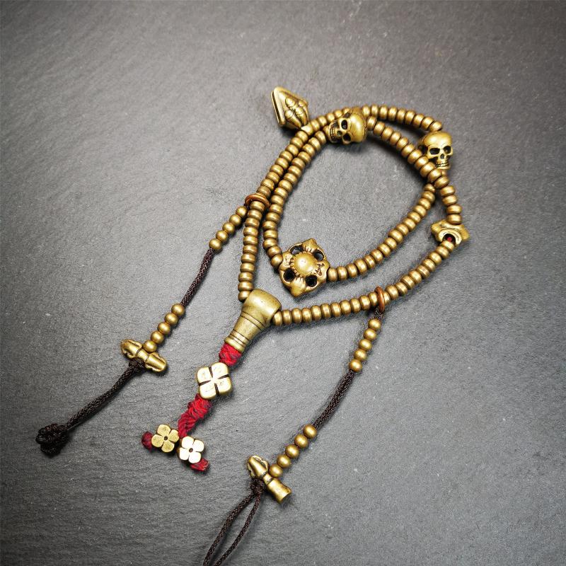 This mala was collect from Hepo Town Baiyu County Tibet 30 years ago, blessed in Yaqing Monastry. The necklace is made of lima brass, total 4 marker beads on it, and 1 set of bead counters ,very delicate and rare.
