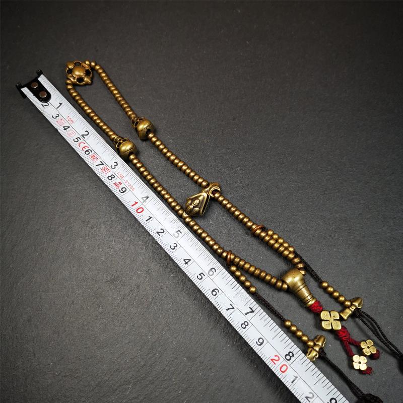 This mala was collect from Hepo Town Baiyu County Tibet 30 years ago, blessed in Yaqing Monastry. The necklace is made of lima brass, total 4 marker beads on it, and 1 set of bead counters ,very delicate and rare.