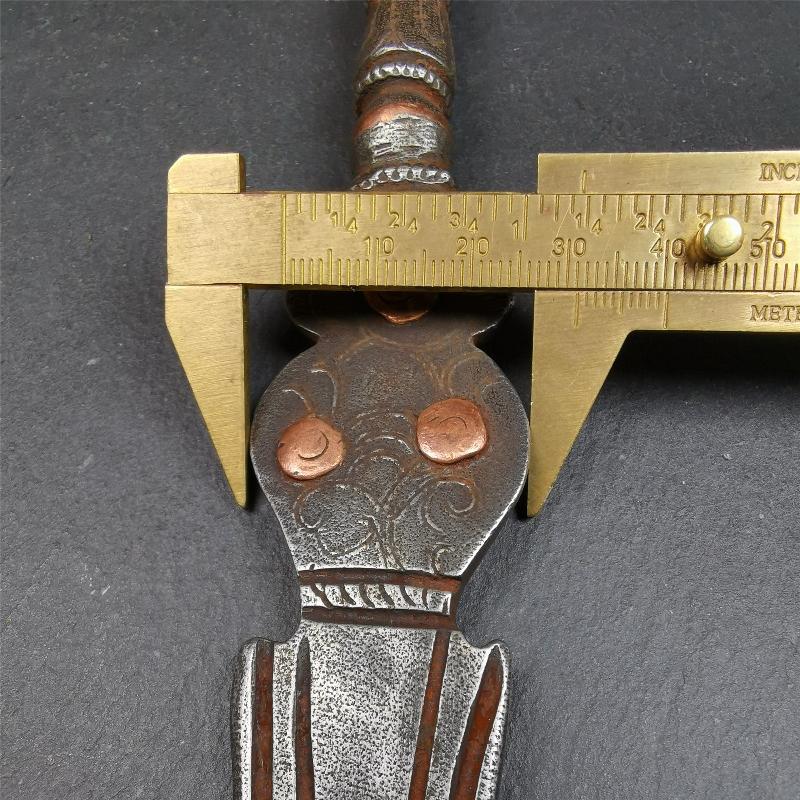 This phurba kila is handmade by Tibetan craftsmen from Tibet in 1990s. It's a kila dagger, phurba,made of cold iron, carved cloud pattern, inlaid red copper, and the half vajra on the handle,8.7 inches length.