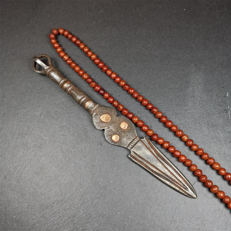 This phurba kila is handmade by Tibetan craftsmen from Tibet in 1990s. It's a kila dagger, phurba,made of cold iron, carved cloud pattern, inlaid red copper, and the half vajra on the handle,8.7 inches length.