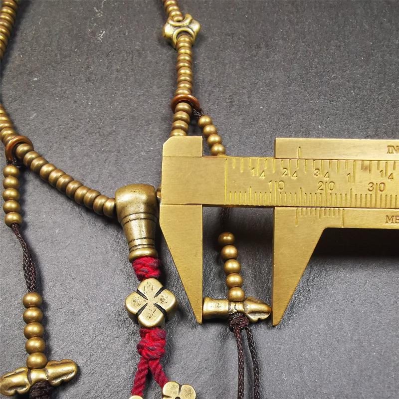 This mala was collect from Hepo Town Baiyu County Tibet 30 years ago, blessed in Yaqing Monastry. The necklace is made of lima brass, total 4 marker beads on it, and 1 set of bead counters ,very delicate and rare.