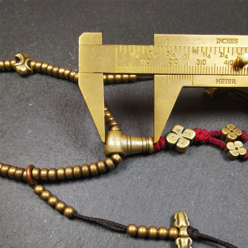 This mala was collect from Hepo Town Baiyu County Tibet 30 years ago, blessed in Yaqing Monastry. The necklace is made of lima brass, total 4 marker beads on it, and 1 set of bead counters ,very delicate and rare.