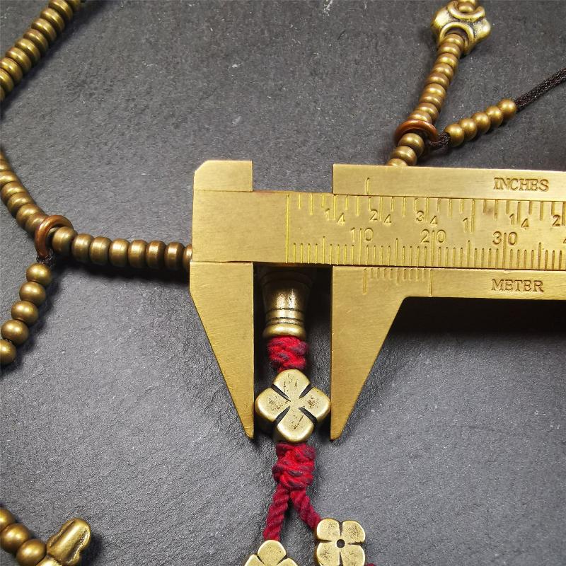 This mala was collect from Hepo Town Baiyu County Tibet 30 years ago, blessed in Yaqing Monastry. The necklace is made of lima brass, total 4 marker beads on it, and 1 set of bead counters ,very delicate and rare.
