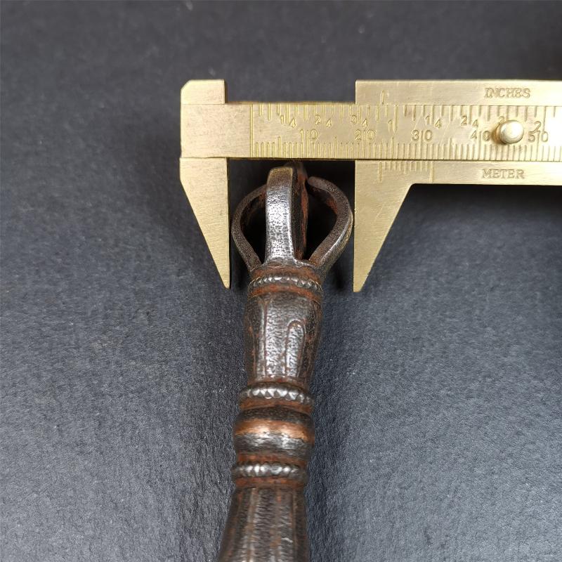 This phurba kila is handmade by Tibetan craftsmen from Tibet in 1990s. It's a kila dagger, phurba,made of cold iron, carved cloud pattern, inlaid red copper, and the half vajra on the handle,8.7 inches length.