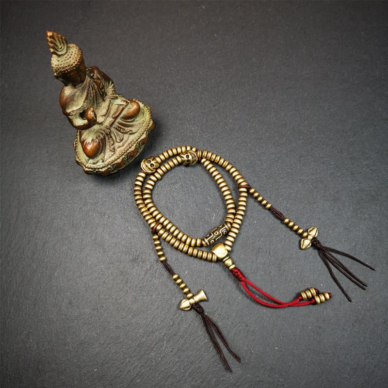 This mala was collect from Hepo Town Baiyu County Tibet 30 years ago, blessed in Yaqing Monastry. The necklace is made of lima brass, total 4 marker beads on it, and 1 set of bead counters ,very delicate and rare.