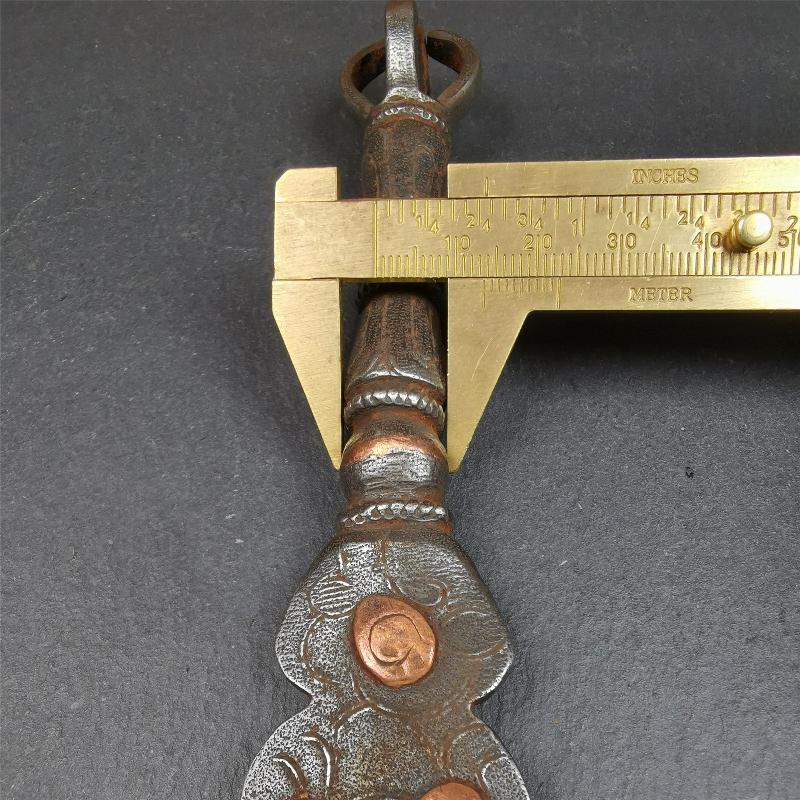 This phurba kila is handmade by Tibetan craftsmen from Tibet in 1990s. It's a kila dagger, phurba,made of cold iron, carved cloud pattern, inlaid red copper, and the half vajra on the handle,8.7 inches length.