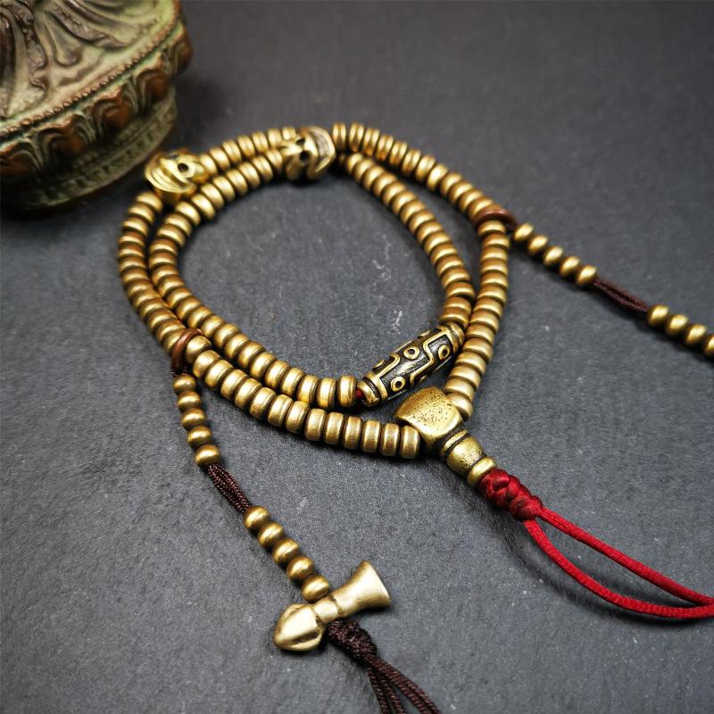 This mala was collect from Hepo Town Baiyu County Tibet 30 years ago, blessed in Yaqing Monastry. The necklace is made of lima brass, total 4 marker beads on it, and 1 set of bead counters ,very delicate and rare.