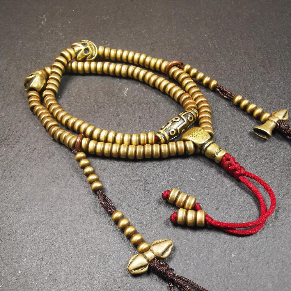This mala was collect from Hepo Town Baiyu County Tibet 30 years ago, blessed in Yaqing Monastry. The necklace is made of lima brass, total 4 marker beads on it, and 1 set of bead counters ,very delicate and rare.