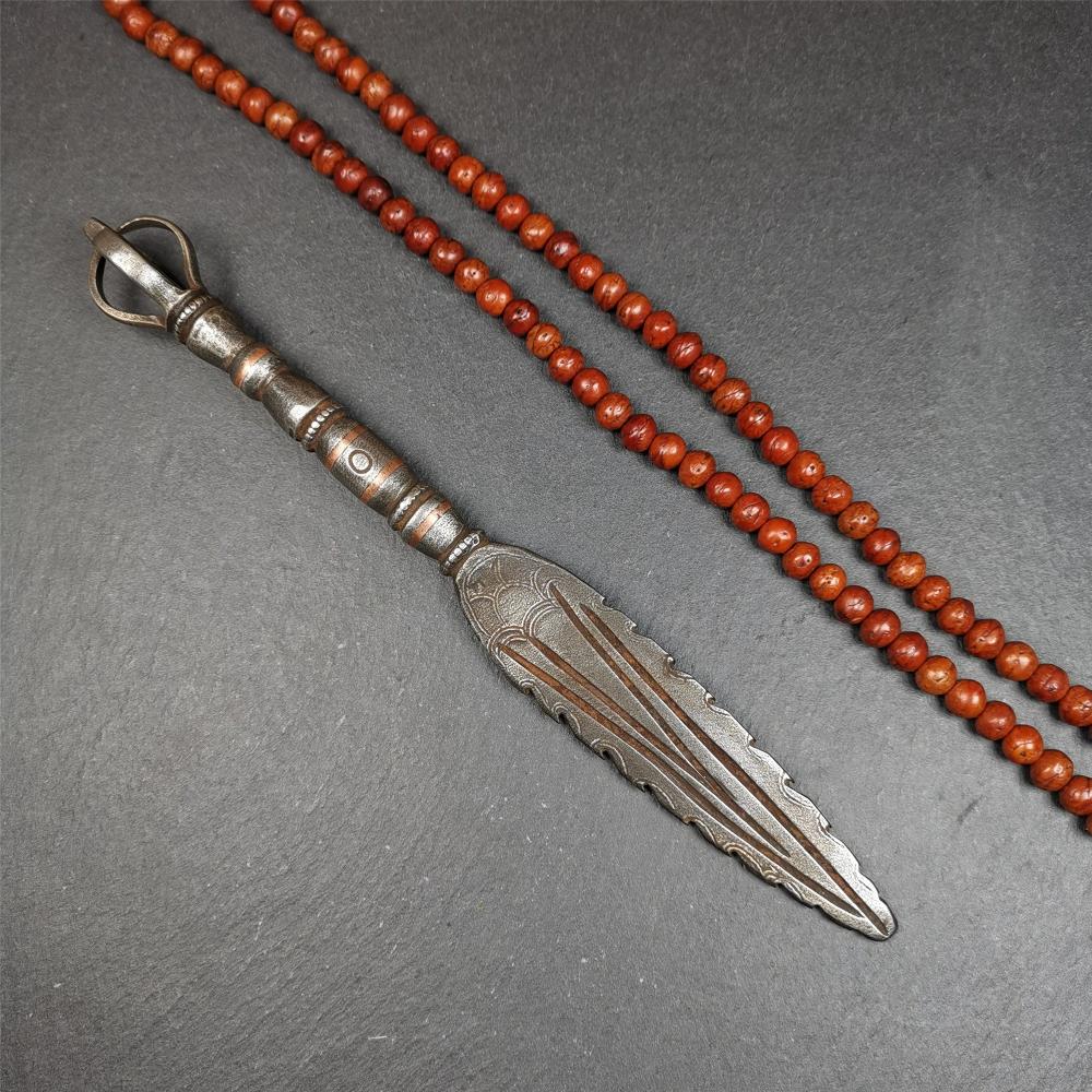 This vajra sword was handmade by Tibetan craftsmen from Tibet in 1990s. It's Fire Vajra Sword of Wisdom Buddha Manjushri,made of cold iron,inlaid red copper stripe,carved with flame pattern, and the half vajra at the tail,8.3 inches length.
