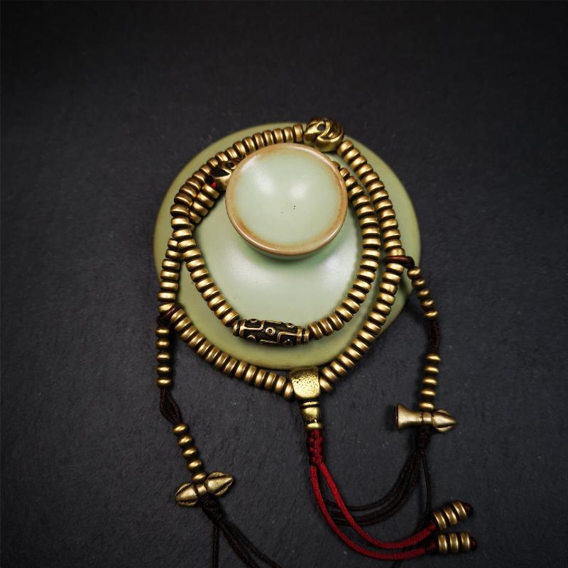 This mala was collect from Hepo Town Baiyu County Tibet 30 years ago, blessed in Yaqing Monastry. The necklace is made of lima brass, total 4 marker beads on it, and 1 set of bead counters ,very delicate and rare.