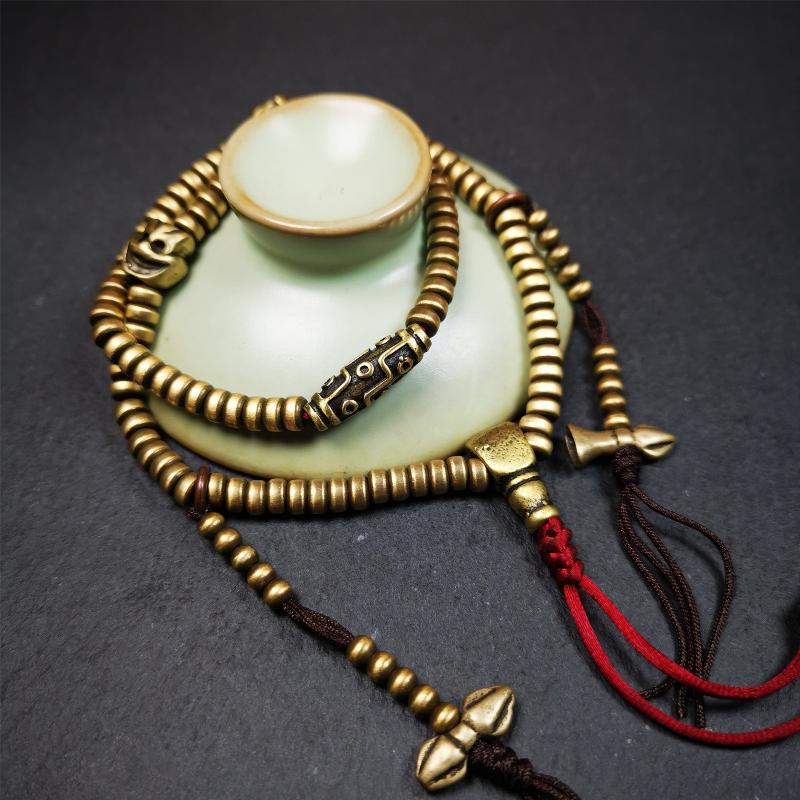 This mala was collect from Hepo Town Baiyu County Tibet 30 years ago, blessed in Yaqing Monastry. The necklace is made of lima brass, total 4 marker beads on it, and 1 set of bead counters ,very delicate and rare.