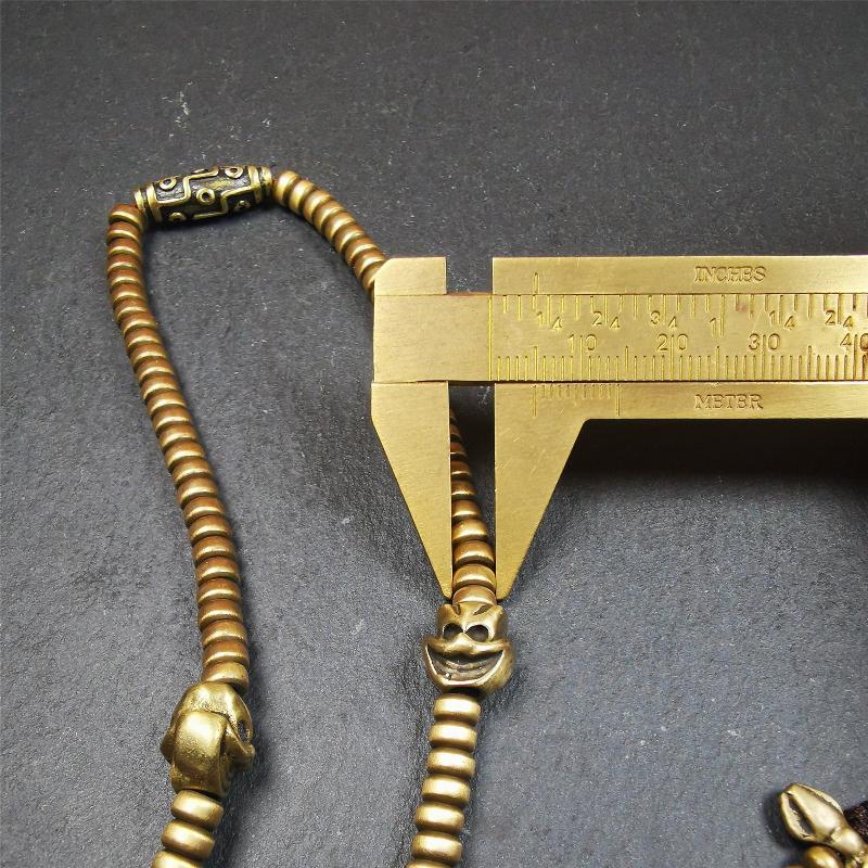 This mala was collect from Hepo Town Baiyu County Tibet 30 years ago, blessed in Yaqing Monastry. The necklace is made of lima brass, total 4 marker beads on it, and 1 set of bead counters ,very delicate and rare.