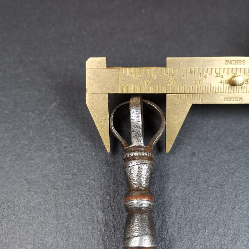 This vajra sword was handmade by Tibetan craftsmen from Tibet in 1990s. It's Fire Vajra Sword of Wisdom Buddha Manjushri,made of cold iron,inlaid red copper stripe,carved with flame pattern, and the half vajra at the tail,8.3 inches length.
