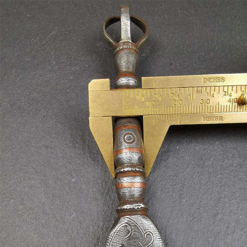 This vajra sword was handmade by Tibetan craftsmen from Tibet in 1990s. It's Fire Vajra Sword of Wisdom Buddha Manjushri,made of cold iron,inlaid red copper stripe,carved with flame pattern, and the half vajra at the tail,8.3 inches length.
