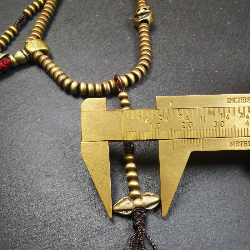 This mala was collect from Hepo Town Baiyu County Tibet 30 years ago, blessed in Yaqing Monastry. The necklace is made of lima brass, total 4 marker beads on it, and 1 set of bead counters ,very delicate and rare.