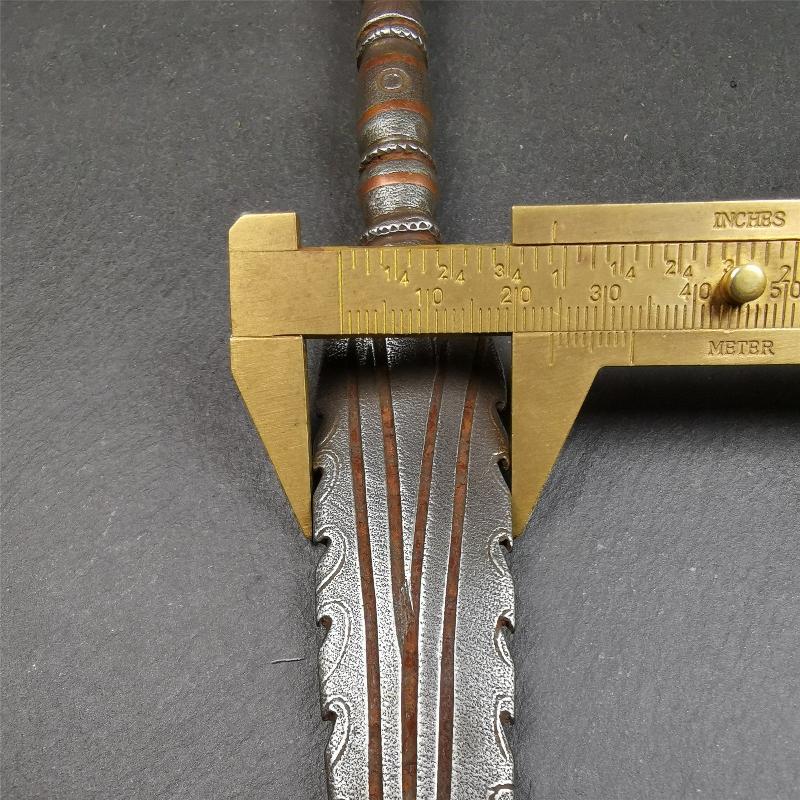 This vajra sword was handmade by Tibetan craftsmen from Tibet in 1990s. It's Fire Vajra Sword of Wisdom Buddha Manjushri,made of cold iron,inlaid red copper stripe,carved with flame pattern, and the half vajra at the tail,8.3 inches length.