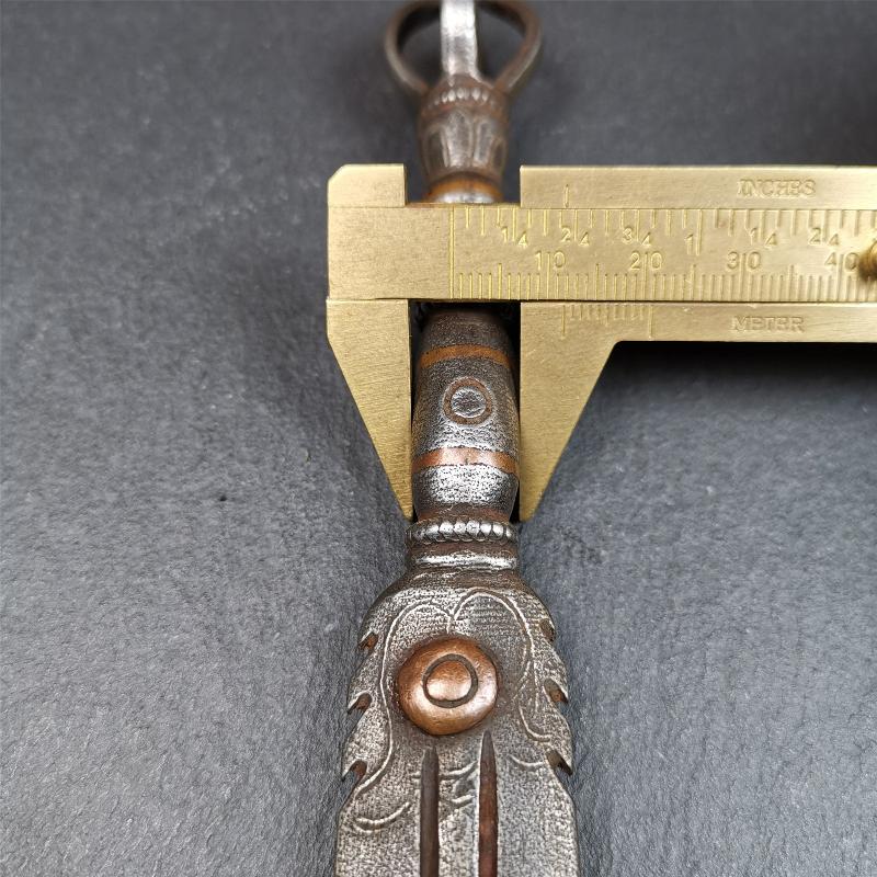 This vajra sword was handmade by Tibetan craftsmen from Tibet in 1990s. It's Fire Vajra Sword of Wisdom Buddha Manjushri,made of cold iron,inlaid red copper stripe,carved with flame pattern, and the half vajra at the tail,7.5 inches length.