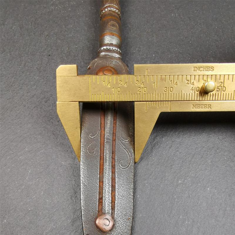 This vajra sword was handmade by Tibetan craftsmen from Tibet in 1990s. It's Fire Vajra Sword of Wisdom Buddha Manjushri,made of cold iron,inlaid red copper stripe,carved with flame pattern, and the half vajra at the tail,7.5 inches length.