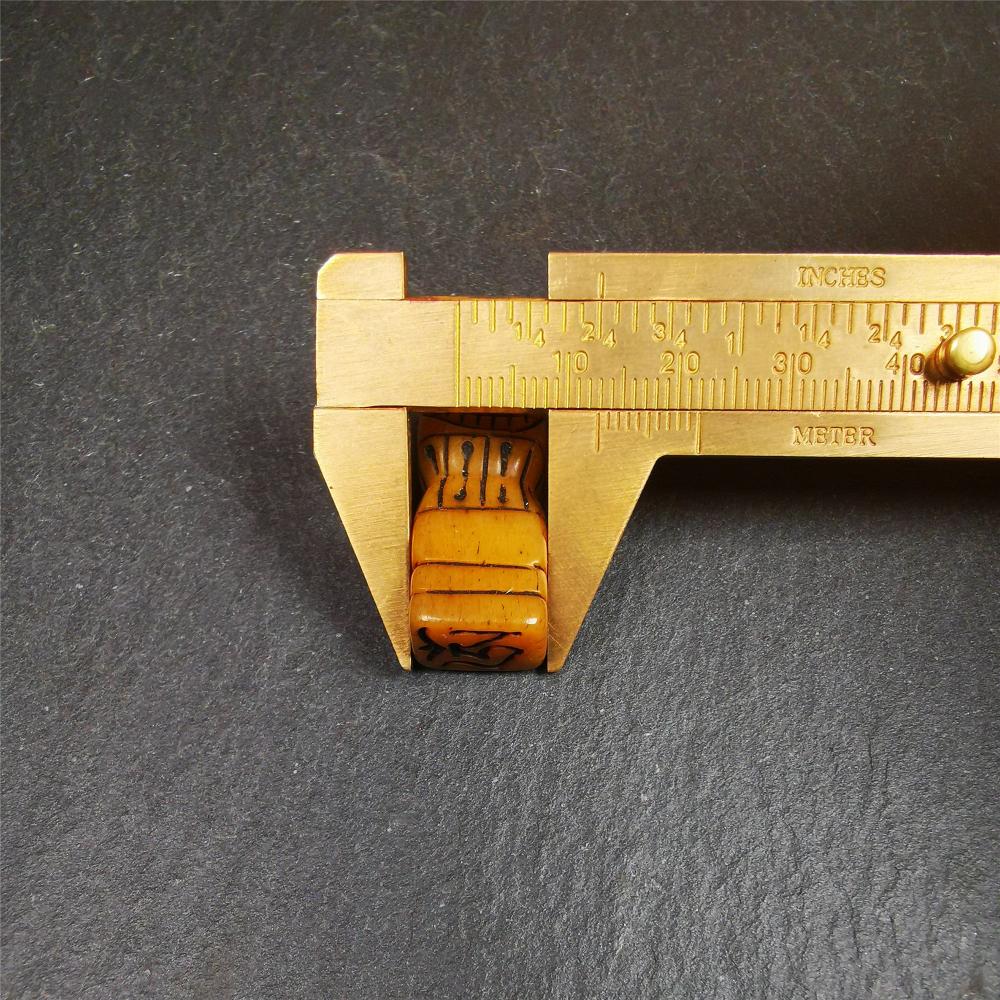 This skull seal amulet was made by Tibetan craftsmen and come from Hepo Town, Baiyu County, the birthplace of the famous Tibetan handicrafts. It's made of yak bone,yellow color,carved skull shape,and OM letter at the bottom,height is inches. You can make it a pendant, keychain.
