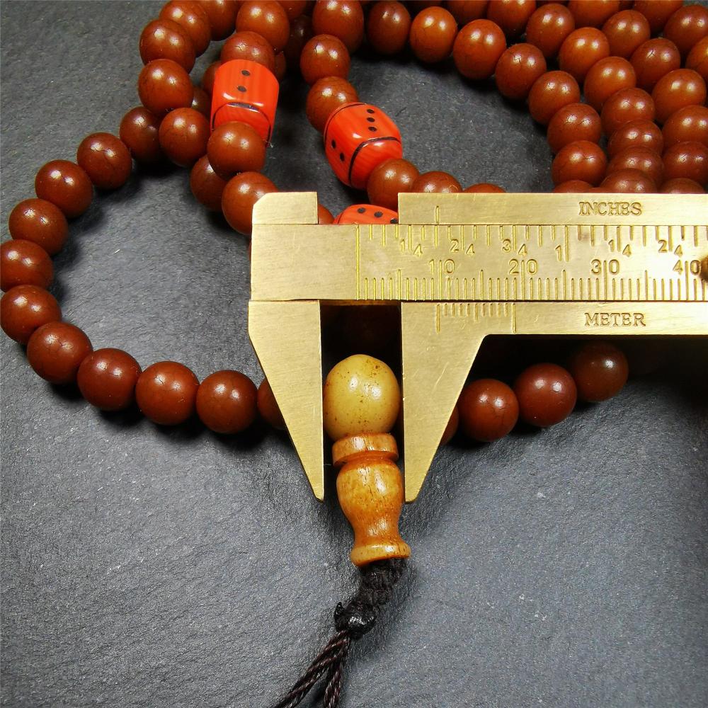 This mala was made by Tibetan craftsmen and come from Hepo Town, Baiyu County, the birthplace of the famous Tibetan handicrafts. It is made of Corypha Linn Seeds, diameter of 8mm / 0.32",circumference is 90cm / 35" ,with 3 dice bead, end of a yak bone guru bead.