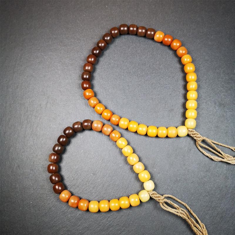 This mala was made by Tibetan craftsmen and come from Hepo Town, Baiyu County, the birthplace of the famous Tibetan handicrafts. It is made of Corypha Linn Seeds, diameter of 10mm / 0.4",gradient color, designed as a couple set,the large size for men, small size for women.