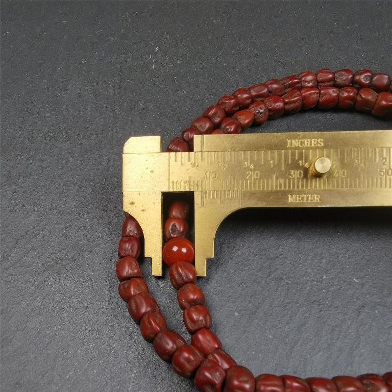 This old Cypress Seed Beads Mala was handmade from tibetan crafts man in Baiyu County,about 30 years old. It is composed of 108 pcs 6.5mm cypress seed beads,then add some old agate beads,end of a agate guru bead.