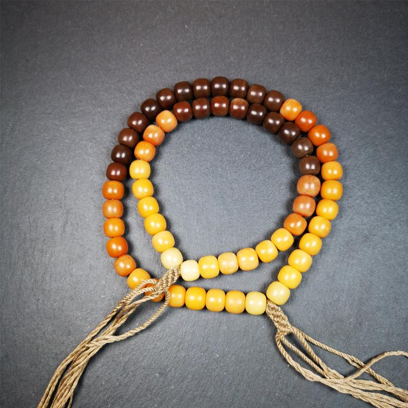 This mala was made by Tibetan craftsmen and come from Hepo Town, Baiyu County, the birthplace of the famous Tibetan handicrafts. It is made of Corypha Linn Seeds, diameter of 10mm / 0.4",gradient color, designed as a couple set,the large size for men, small size for women.