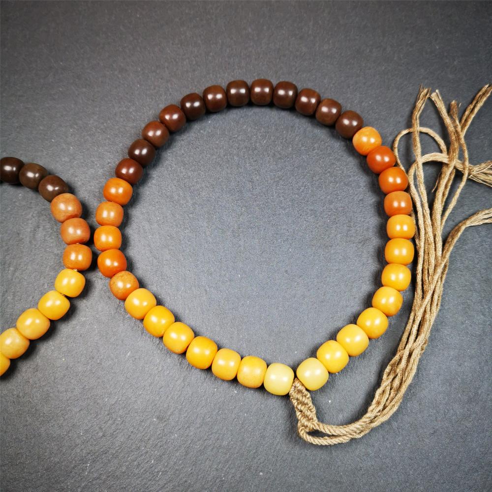 This mala was made by Tibetan craftsmen and come from Hepo Town, Baiyu County, the birthplace of the famous Tibetan handicrafts. It is made of Corypha Linn Seeds, diameter of 10mm / 0.4",gradient color, designed as a couple set,the large size for men, small size for women.