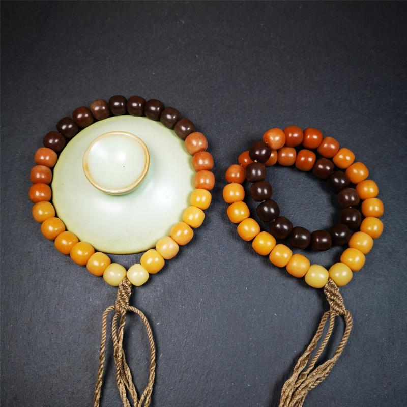 This mala was made by Tibetan craftsmen and come from Hepo Town, Baiyu County, the birthplace of the famous Tibetan handicrafts. It is made of Corypha Linn Seeds, diameter of 10mm / 0.4",gradient color, designed as a couple set,the large size for men, small size for women.