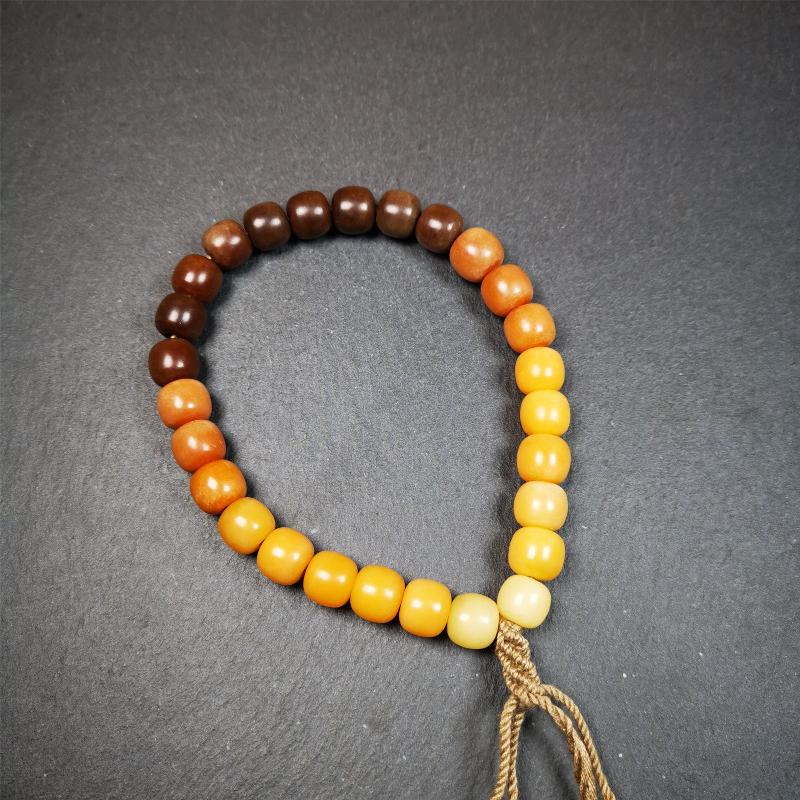 This mala was made by Tibetan craftsmen and come from Hepo Town, Baiyu County, the birthplace of the famous Tibetan handicrafts. It is made of Corypha Linn Seeds, diameter of 10mm / 0.4",gradient color, designed as a couple set,the large size for men, small size for women.