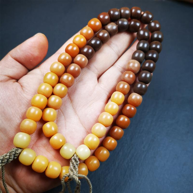This mala was made by Tibetan craftsmen and come from Hepo Town, Baiyu County, the birthplace of the famous Tibetan handicrafts. It is made of Corypha Linn Seeds, diameter of 10mm / 0.4",gradient color, designed as a couple set,the large size for men, small size for women.