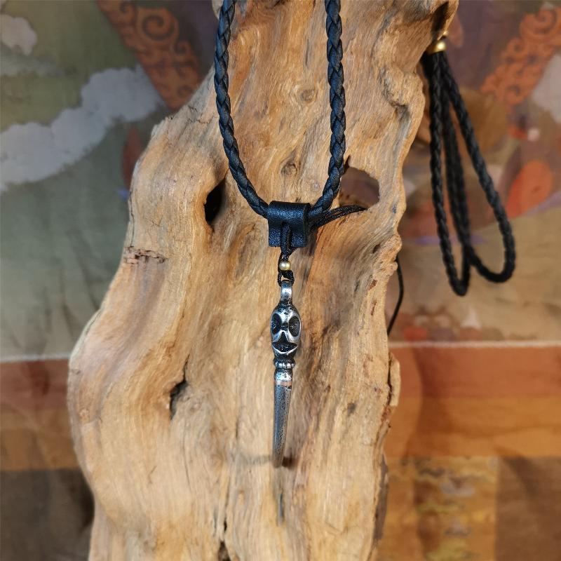This wolf tooth pendant is made by Tibetan craftsmen and come from Hepo Town, Baiyu County, the birthplace of the famous Tibetan handicrafts. It's made of cold iron and inlaid copper,the body is black color,length is 2.16 inches. You can make it a necklace or mala pendant, or keychain.